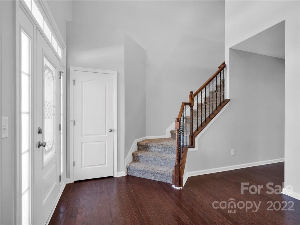 10502 Ebbets Road Charlotte, NC 28273 - Photo 3 of 48 a view of an entryway with wooden floor
