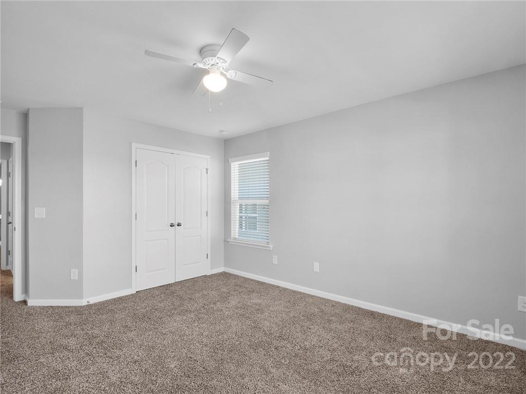 10502 Ebbets Road Charlotte, NC 28273 - Photo 34 of 48 a view of a livingroom with a ceiling fan and window