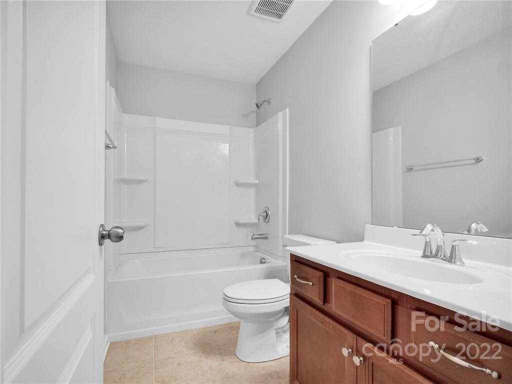 10502 Ebbets Road Charlotte, NC 28273 - Photo 35 of 48 a bathroom with a sink a toilet and shower