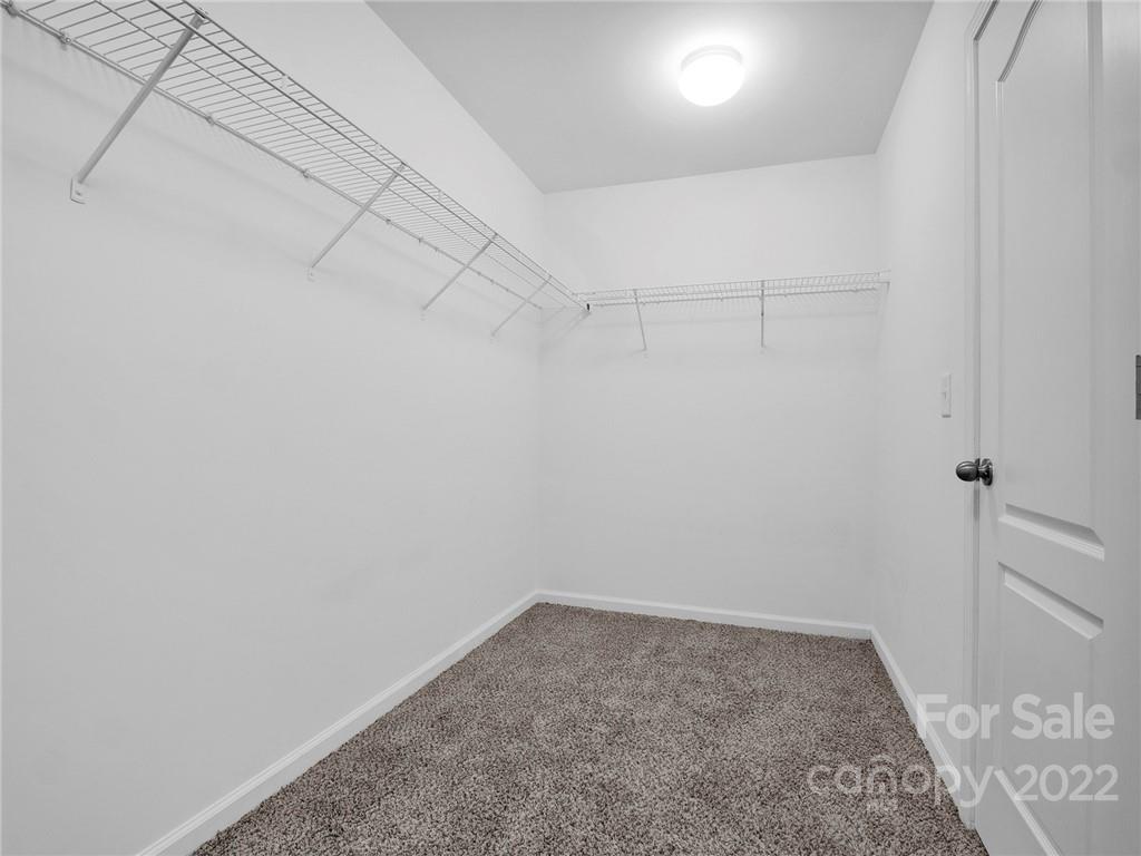 10502 Ebbets Road Charlotte, NC 28273 - Photo 39 of 48 a view of a room with racks on the wall