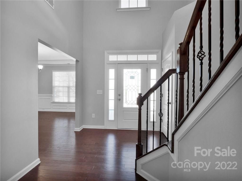 10502 Ebbets Road Charlotte, NC 28273 - Photo 4 of 48 a view of an entryway with wooden floor
