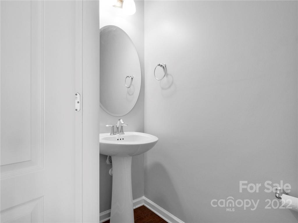 10502 Ebbets Road Charlotte, NC 28273 - Photo 44 of 48 a bathroom with a sink and mirror