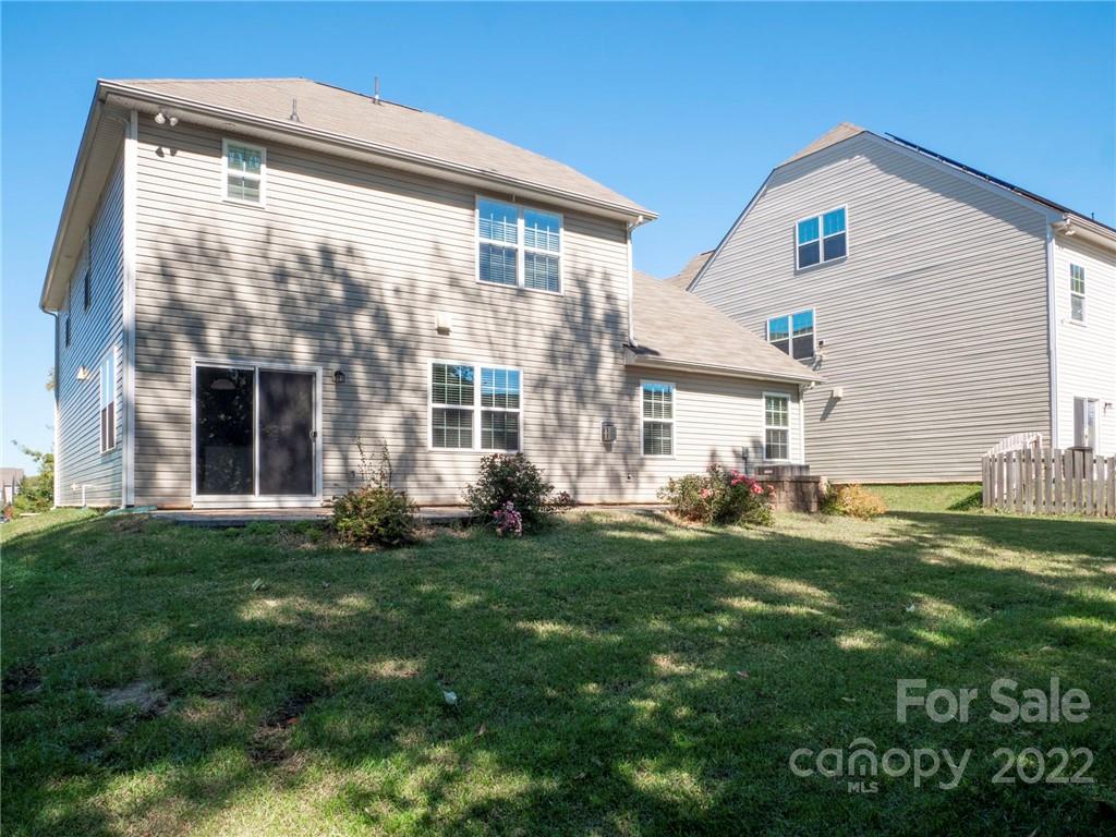 10502 Ebbets Road Charlotte, NC 28273 - Photo 48 of 48 a front view of a house with a garden
