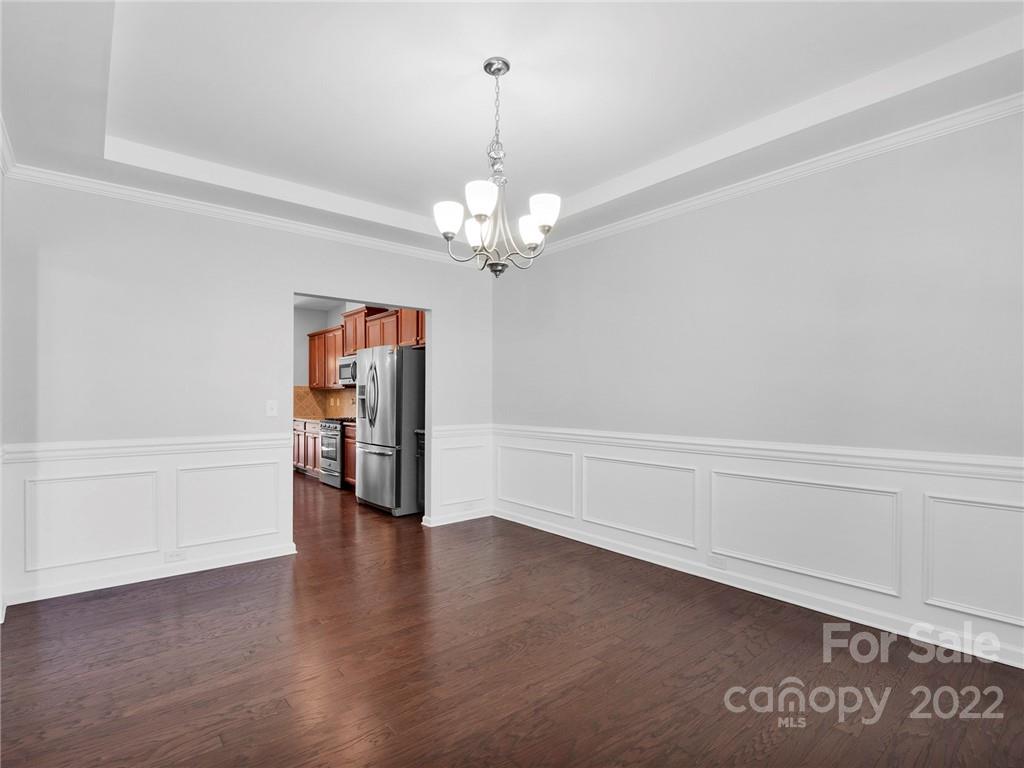 10502 Ebbets Road Charlotte, NC 28273 - Photo 7 of 48 wooden floor in an empty room with a window