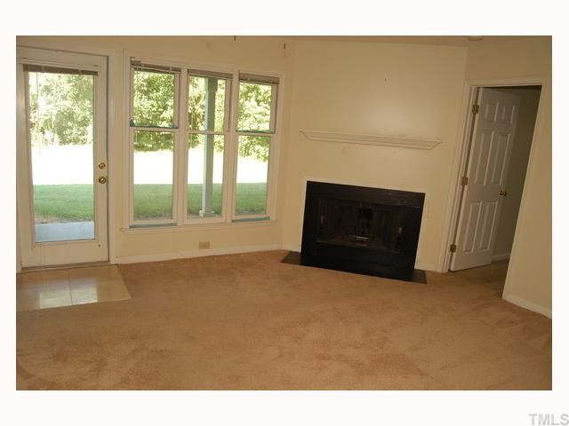 2811 Edridge Court, Unit 101 Raleigh, NC 27607 - Photo 3 of 5 Large family room goes out onto covered back porch. Wonderful private wooded view Den/Family/Great Room