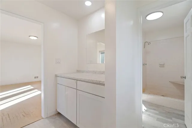a bathroom with a sink a vanity and a mirror