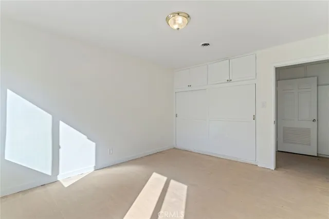 a bathroom with a sink a light fixture and a toilet