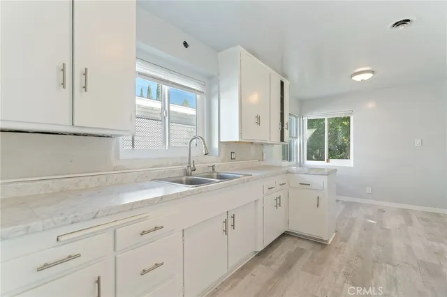 a kitchen with sink and window