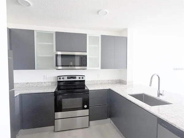 a kitchen with a stove and a sink