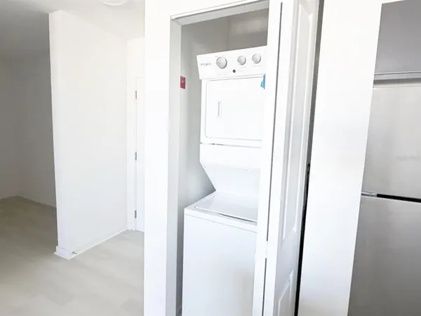 a white toilet sitting next to a bath tub