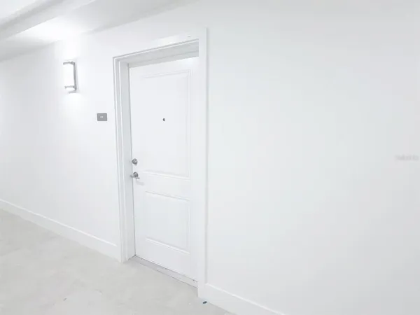 a picture of a wall with a white cabinet
