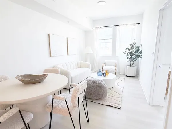 a living room with furniture and a table