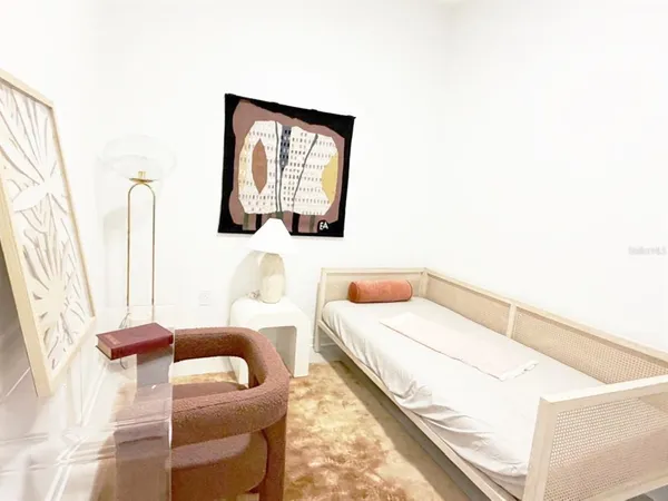 a bedroom with a bed and couch