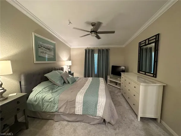 a bed room with a bed and a tv