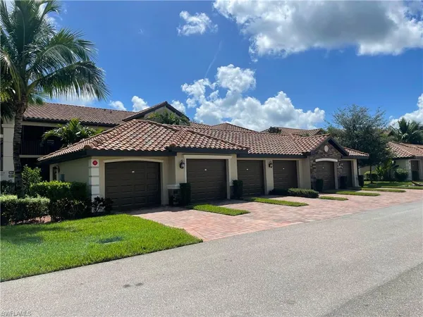 a view of a house with a small garden