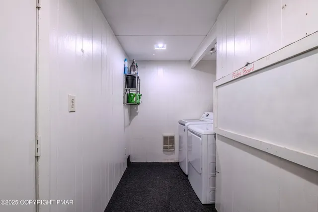 a view of hallway with washer and dryer