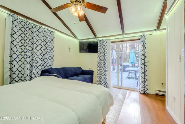 a bedroom with a bed and a walk in closet