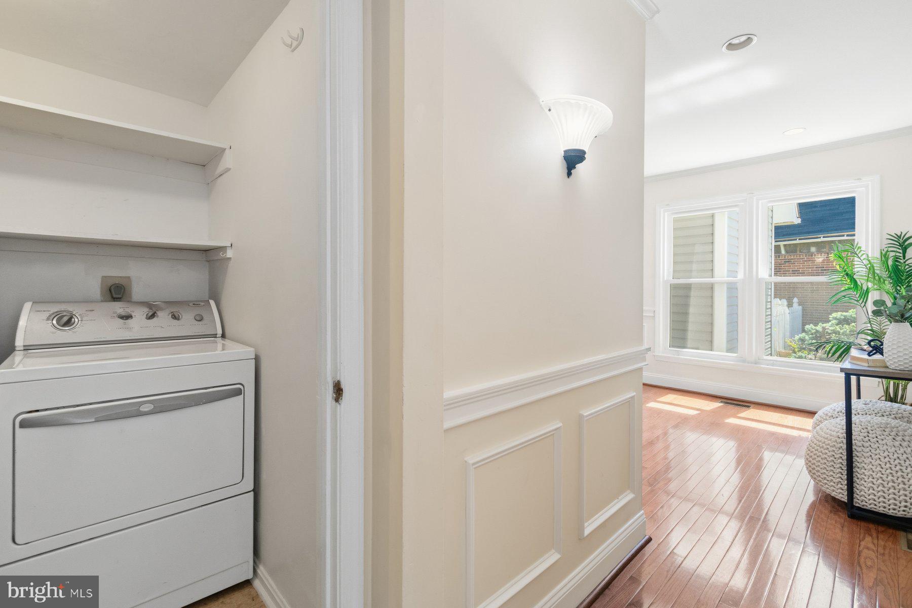 14215 Greenview Drive Laurel, MD 20708 - Photo 17 of 35 a view of washer and dryer with wooden floor