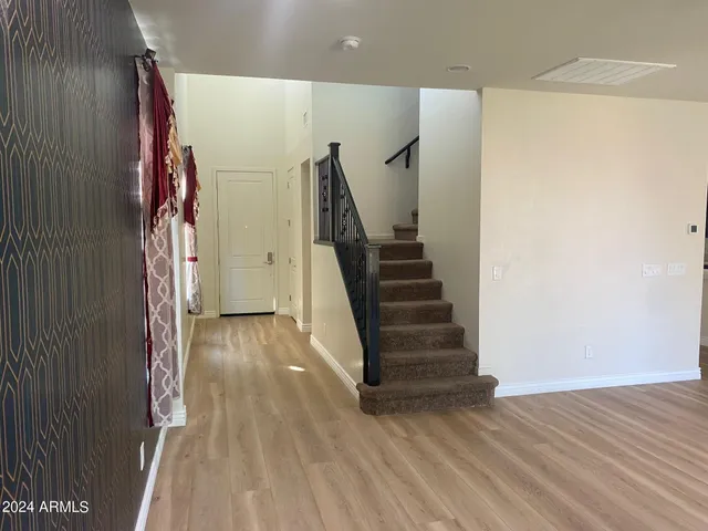 a view of entryway with wooden floor