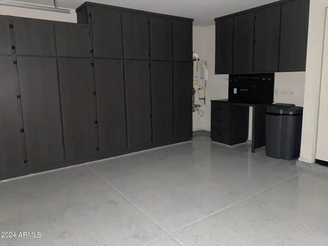 a view of a storage & utility room with a sink