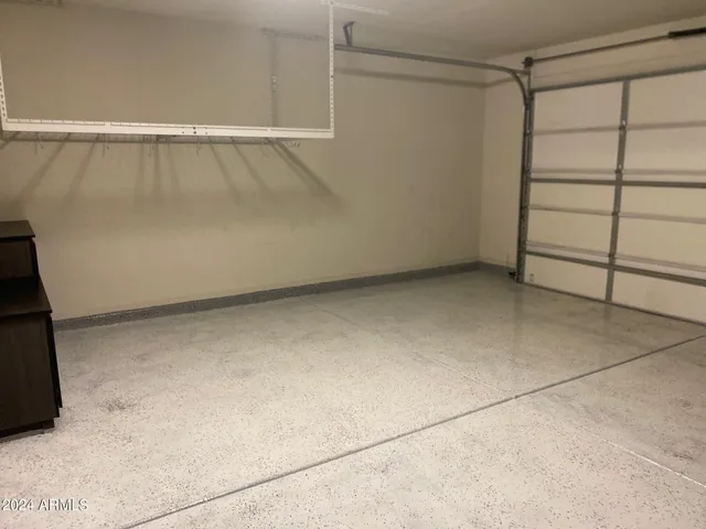 a view of a patio with a table and chairs