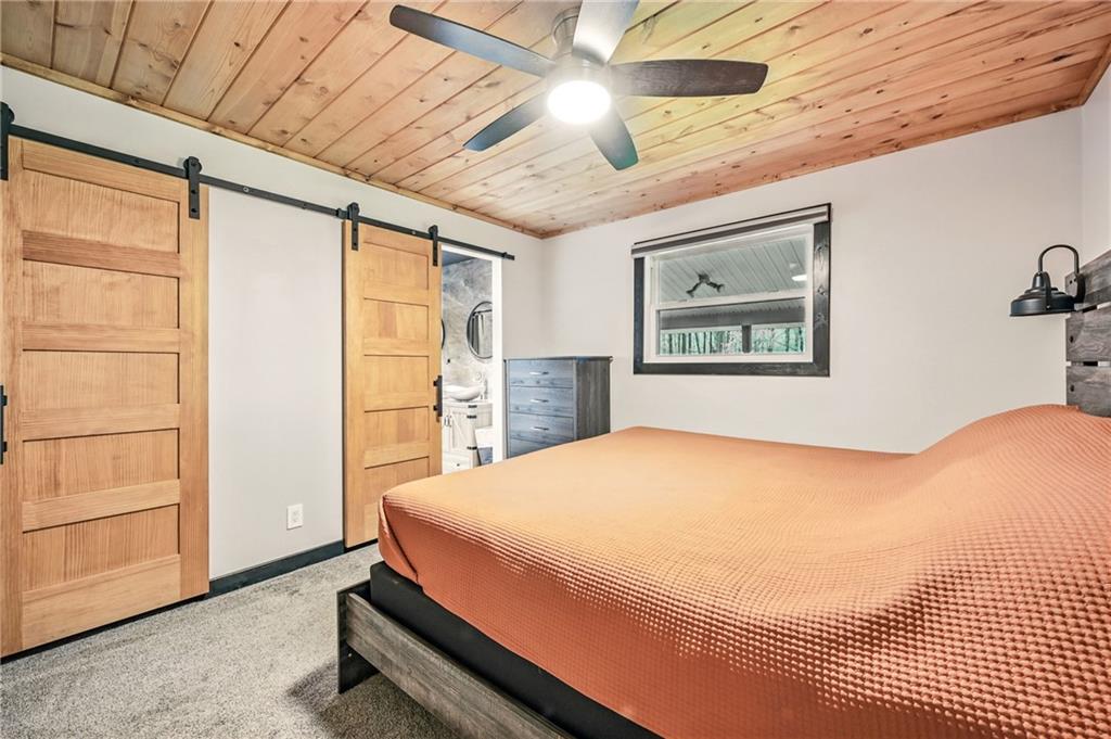 965 Rutledge Road Transfer, PA 16154 - Photo 23 of 50 Featuring en suite bathroom, barn doors & wood ceiling