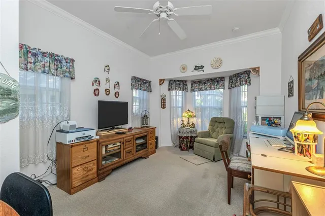 an aerial view of a residential houses with yard and swimming pool