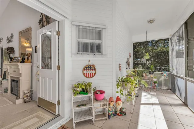 a dining room with furniture a chandelier and window