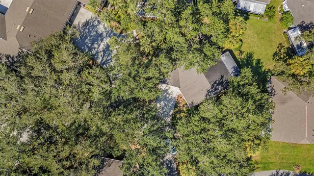 an aerial view of a house with a lake view