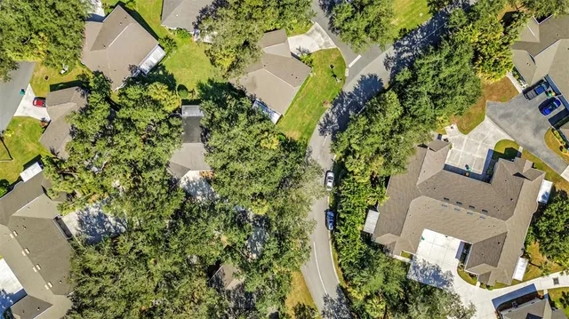 an aerial view of a house with a lake view