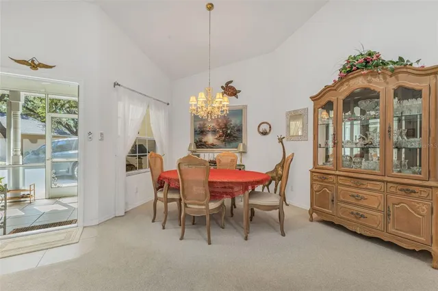 a living room with furniture large window and fireplace