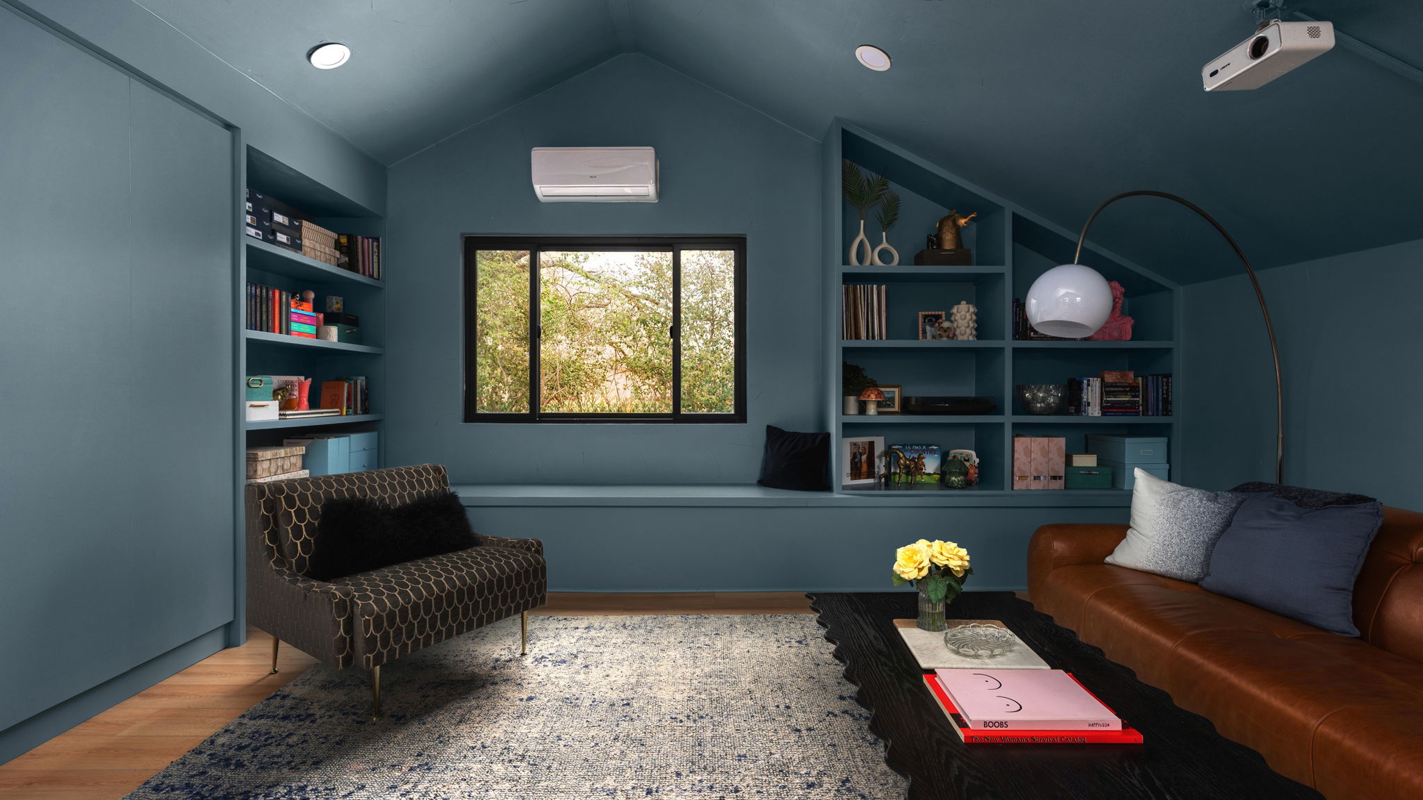 404 Whitetail Drive Manchaca, TX 78652 - Photo 21 of 33 Living area with built in shelves and wood finished floors