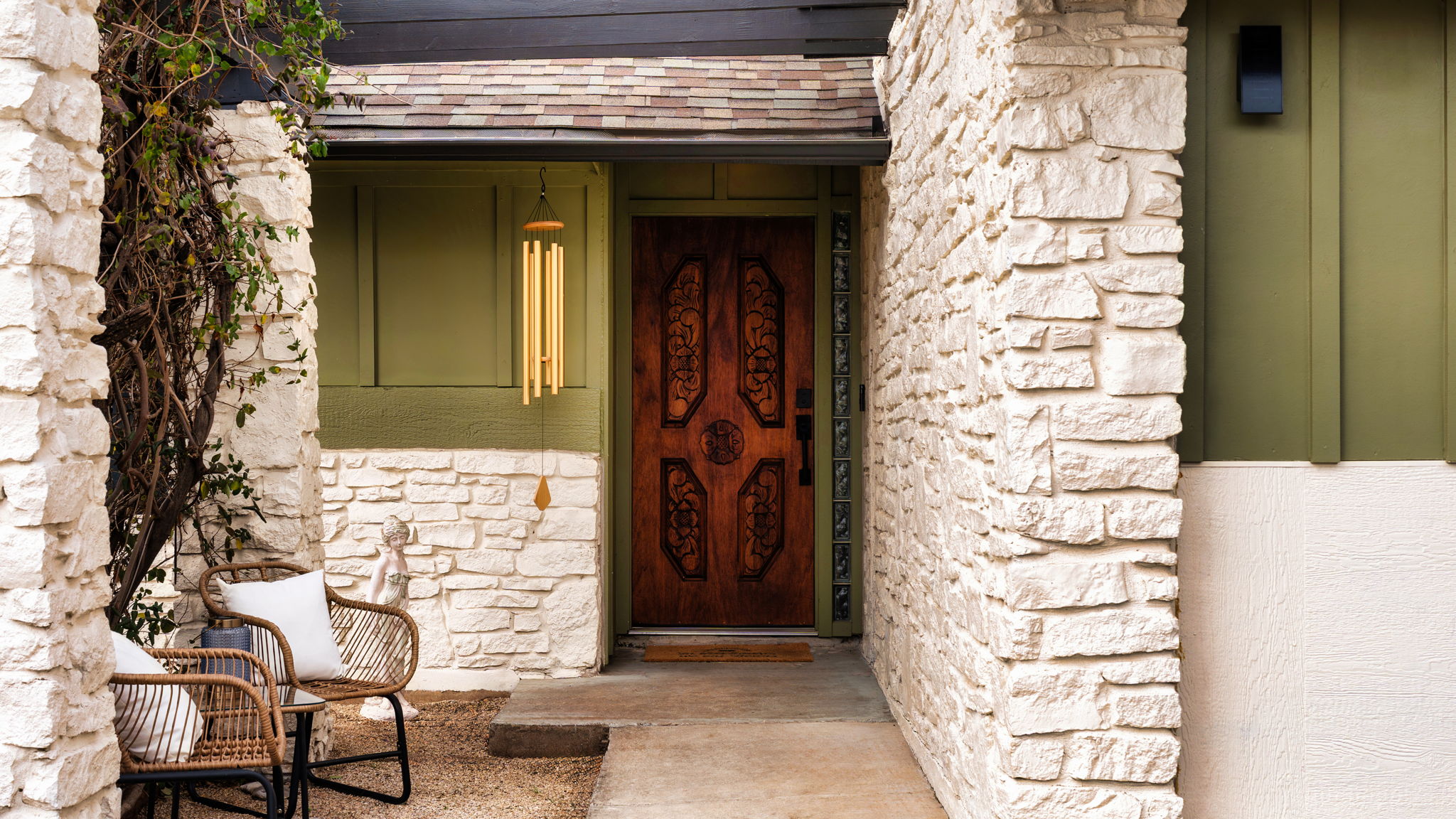 404 Whitetail Drive Manchaca, TX 78652 - Photo 3 of 33 Doorway to property featuring stone siding and roof with shingles