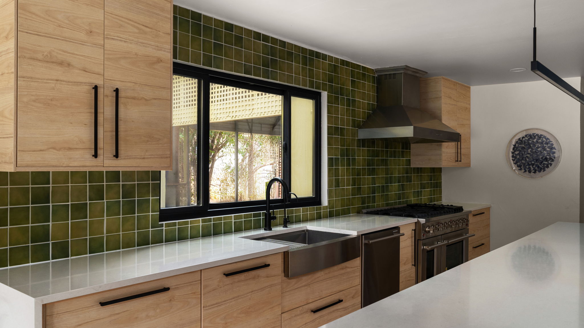 404 Whitetail Drive Manchaca, TX 78652 - Photo 6 of 33 Kitchen with modern cabinets, light wood finish cabinets, light stone countertops, and double oven range