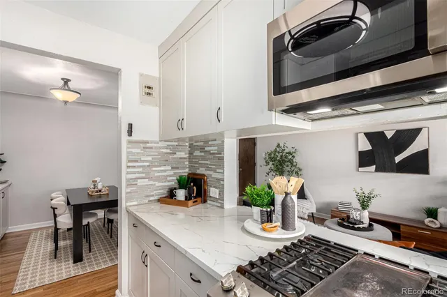 a kitchen with a stove and a microwave
