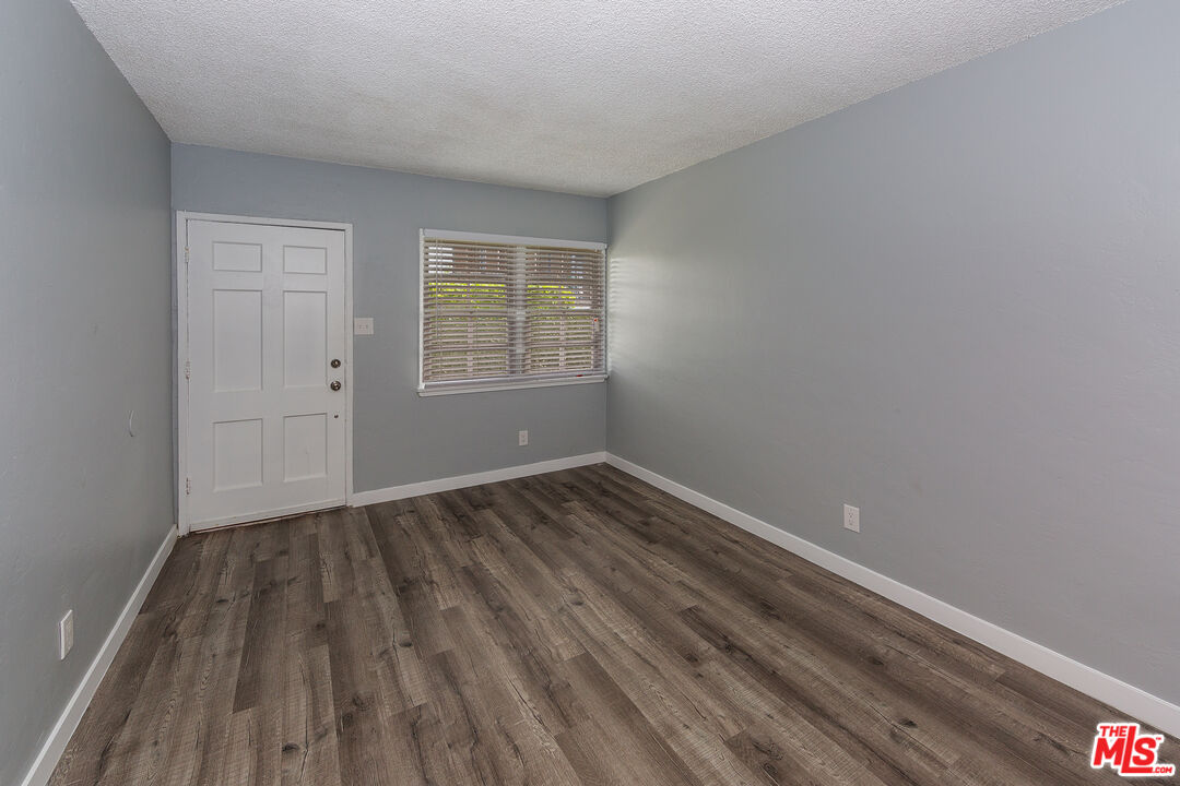 1430 Chestnut Avenue Long Beach, CA 90813 - Photo 2 of 11 an empty room with wooden floor and windows