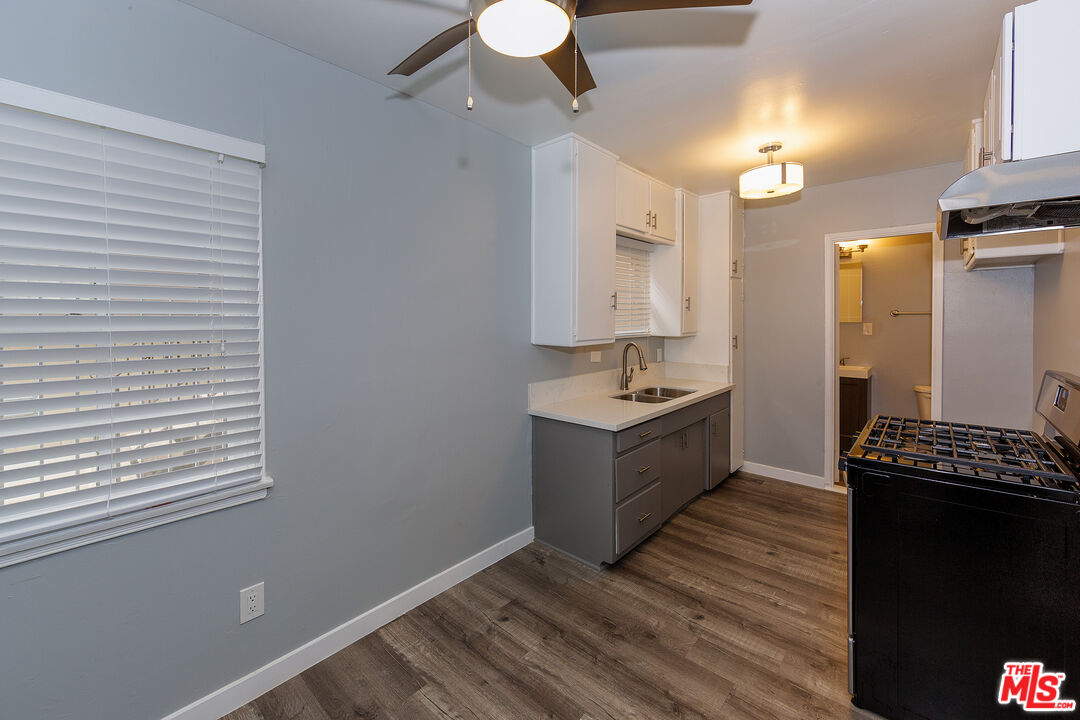 1430 Chestnut Avenue Long Beach, CA 90813 - Photo 4 of 11 a bathroom with a sink a vanity and a mirror