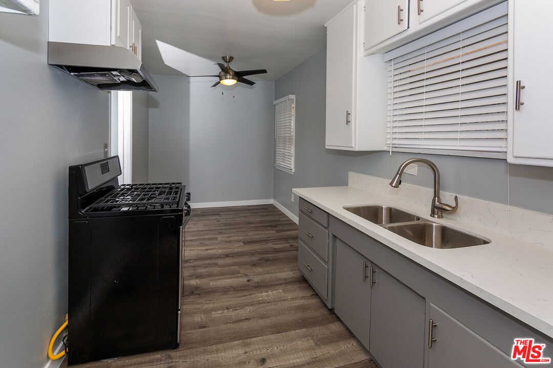 1430 Chestnut Avenue Long Beach, CA 90813 - Photo 5 of 11 a kitchen with a sink and cabinets
