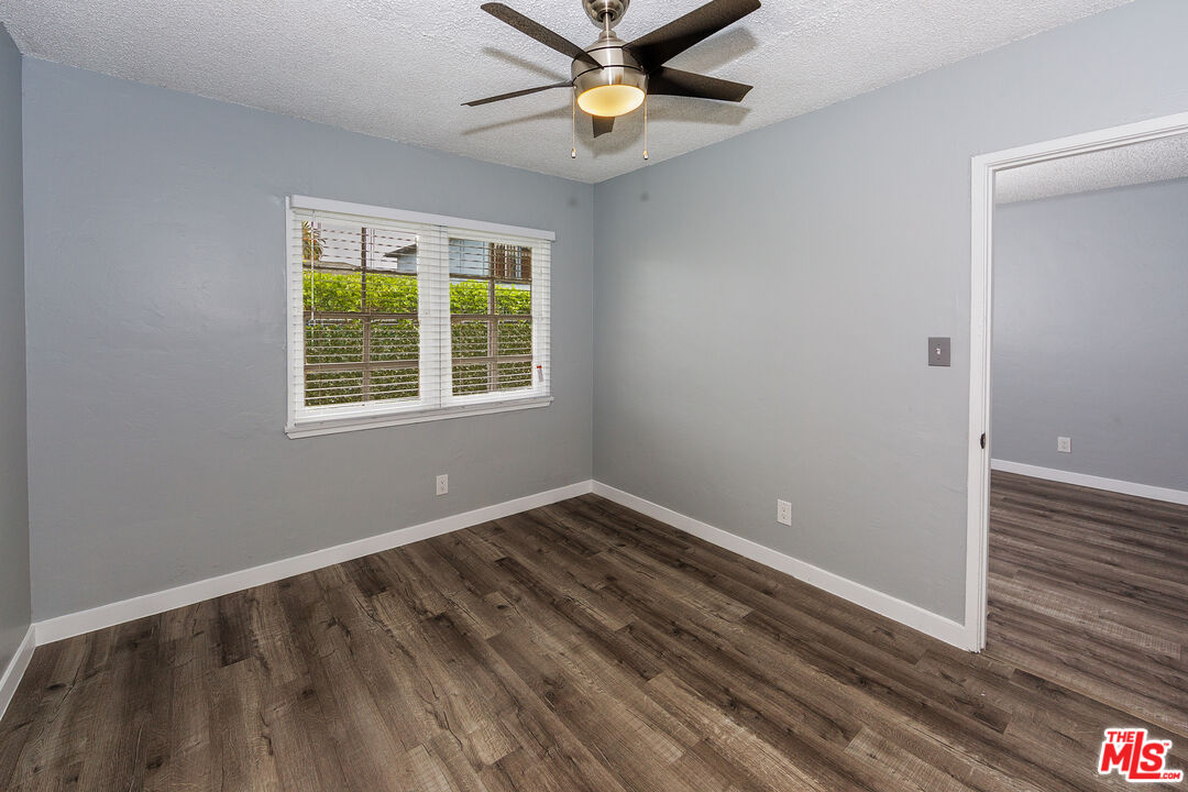1430 Chestnut Avenue Long Beach, CA 90813 - Photo 6 of 11 a view of an empty room with window and wooden floor