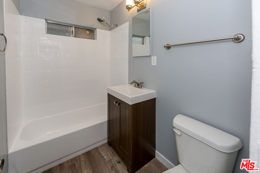 1430 Chestnut Avenue Long Beach, CA 90813 - Photo 7 of 11 a bathroom with a sink toilet and shower