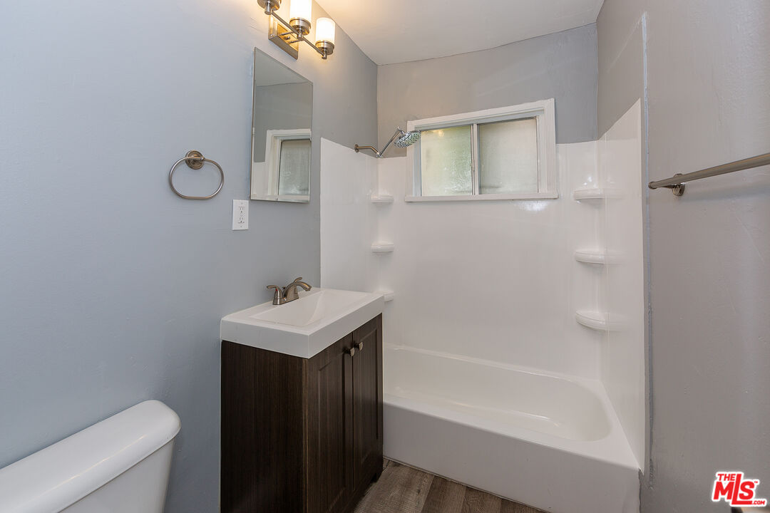 1430 Chestnut Avenue Long Beach, CA 90813 - Photo 8 of 11 a bathroom with a sink a toilet and shower