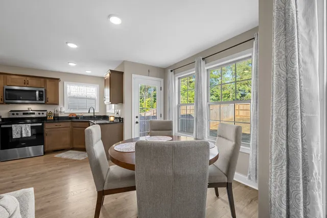 a view of a dining room with furniture window and outside view