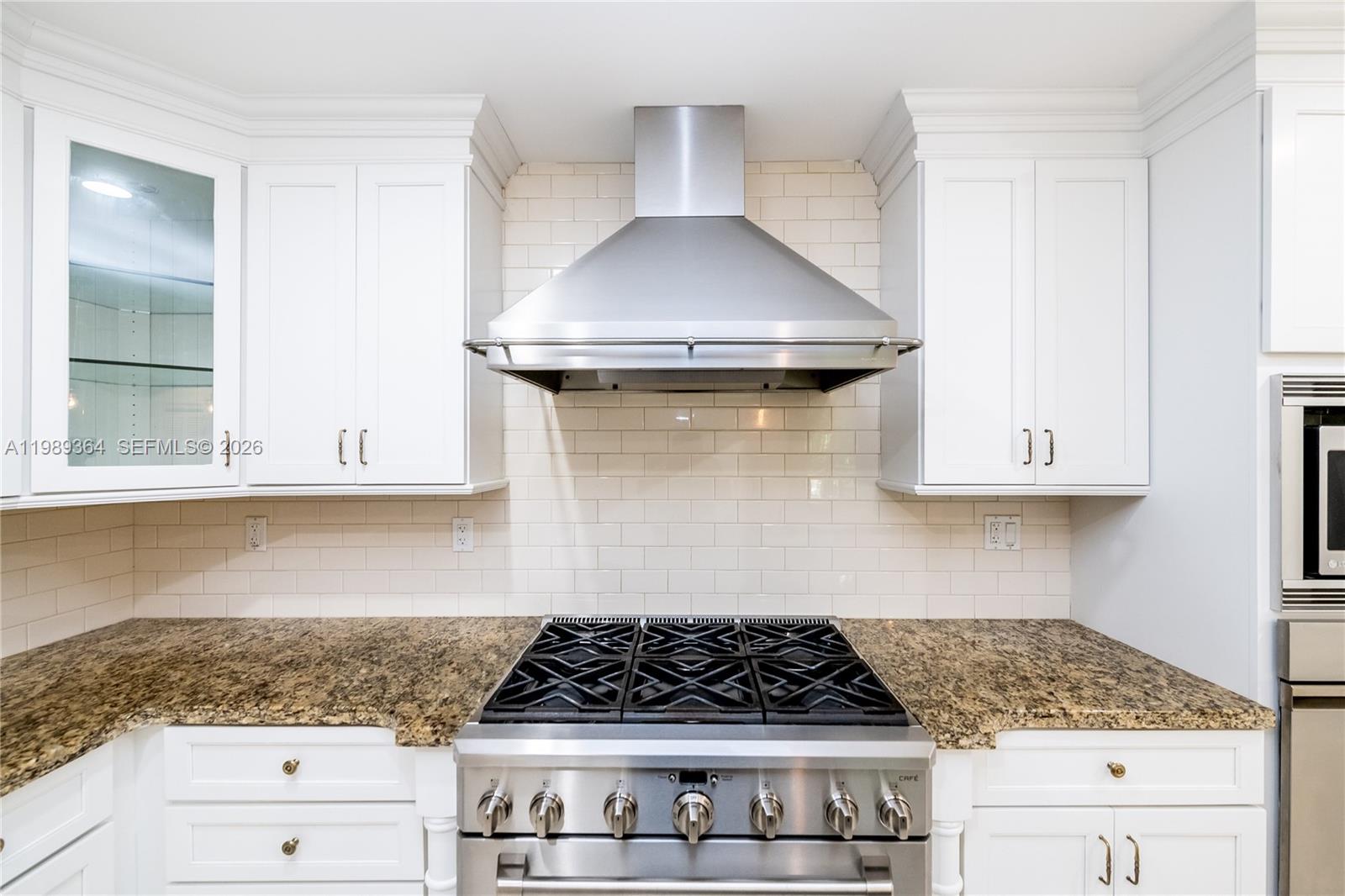 4160 Bay Point Road Miami, FL 33137 - Photo 20 of 60 a kitchen with a stove and cabinets