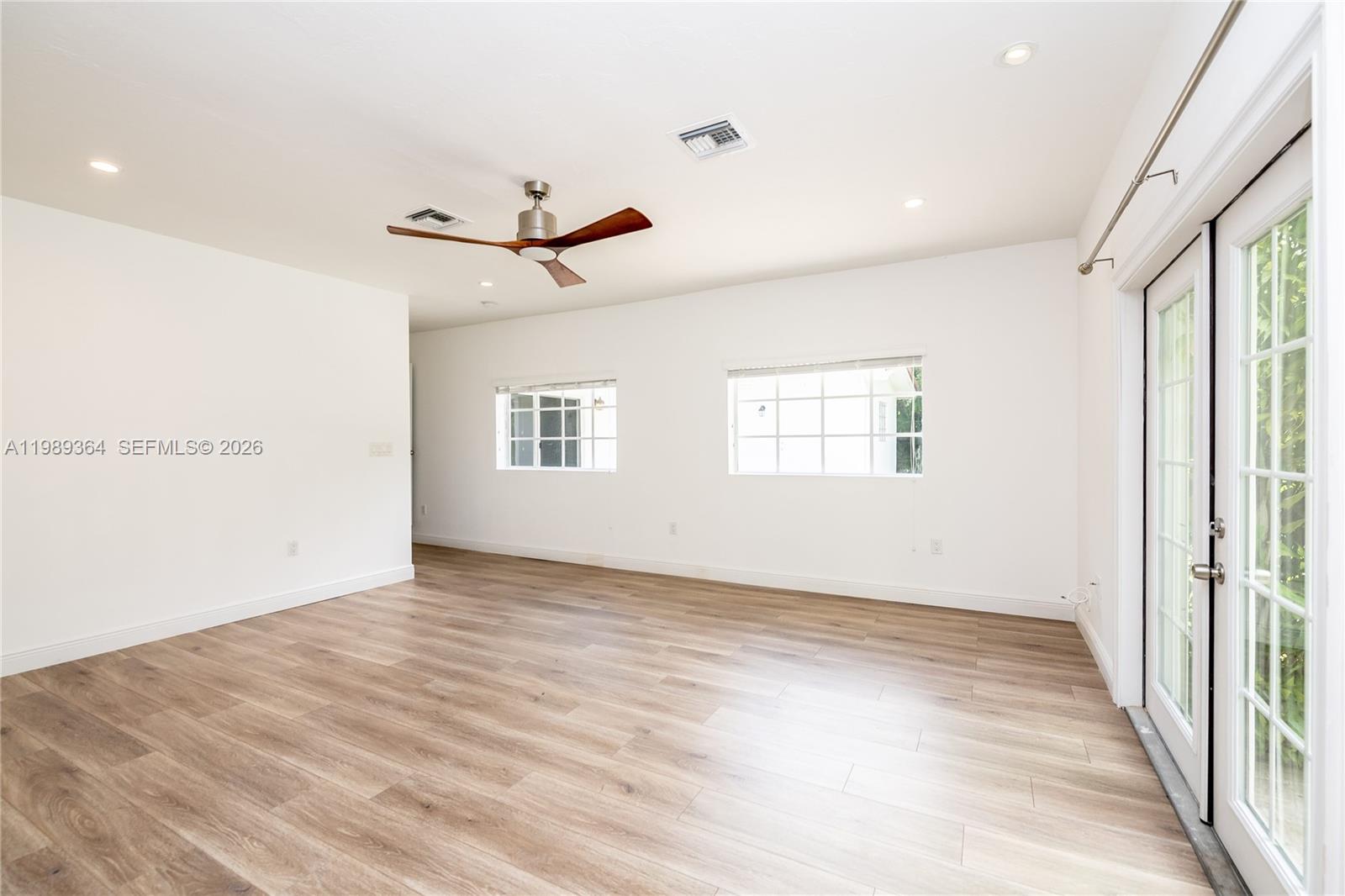 4160 Bay Point Road Miami, FL 33137 - Photo 33 of 60 a view of an empty room with a window