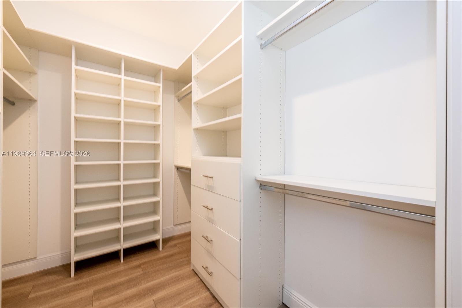 4160 Bay Point Road Miami, FL 33137 - Photo 38 of 60 a view of walk in closet with empty racks