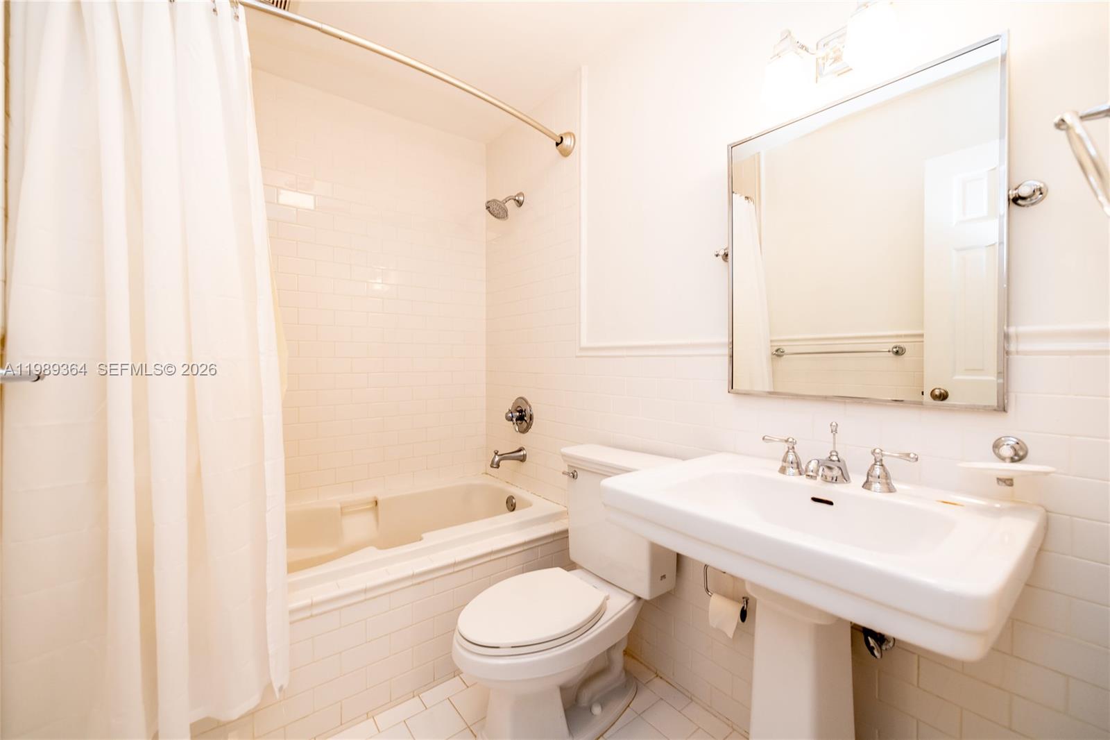 4160 Bay Point Road Miami, FL 33137 - Photo 45 of 60 a bathroom with a sink toilet and shower