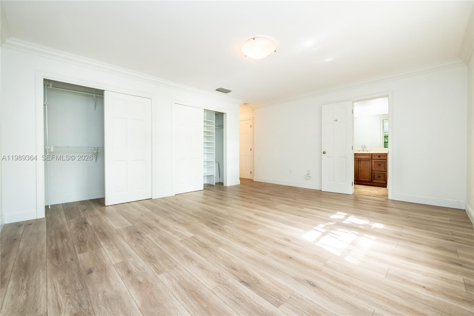 4160 Bay Point Road Miami, FL 33137 - Photo 46 of 60 a view of empty room with wooden floor