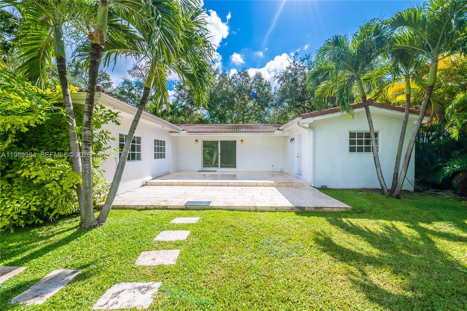 4160 Bay Point Road Miami, FL 33137 - Photo 60 of 60 a view of a house with a yard and tree s