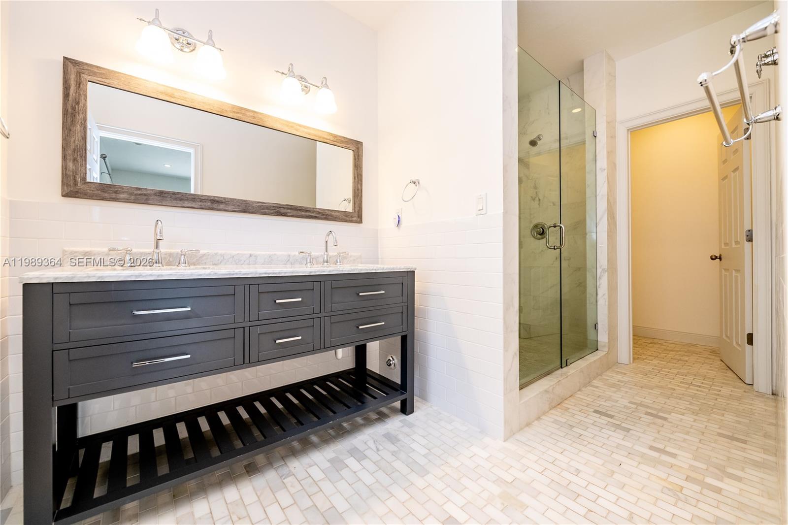 4160 Bay Point Road Miami, FL 33137 - Photo 6 of 60 a bathroom with a granite countertop sink mirror and a