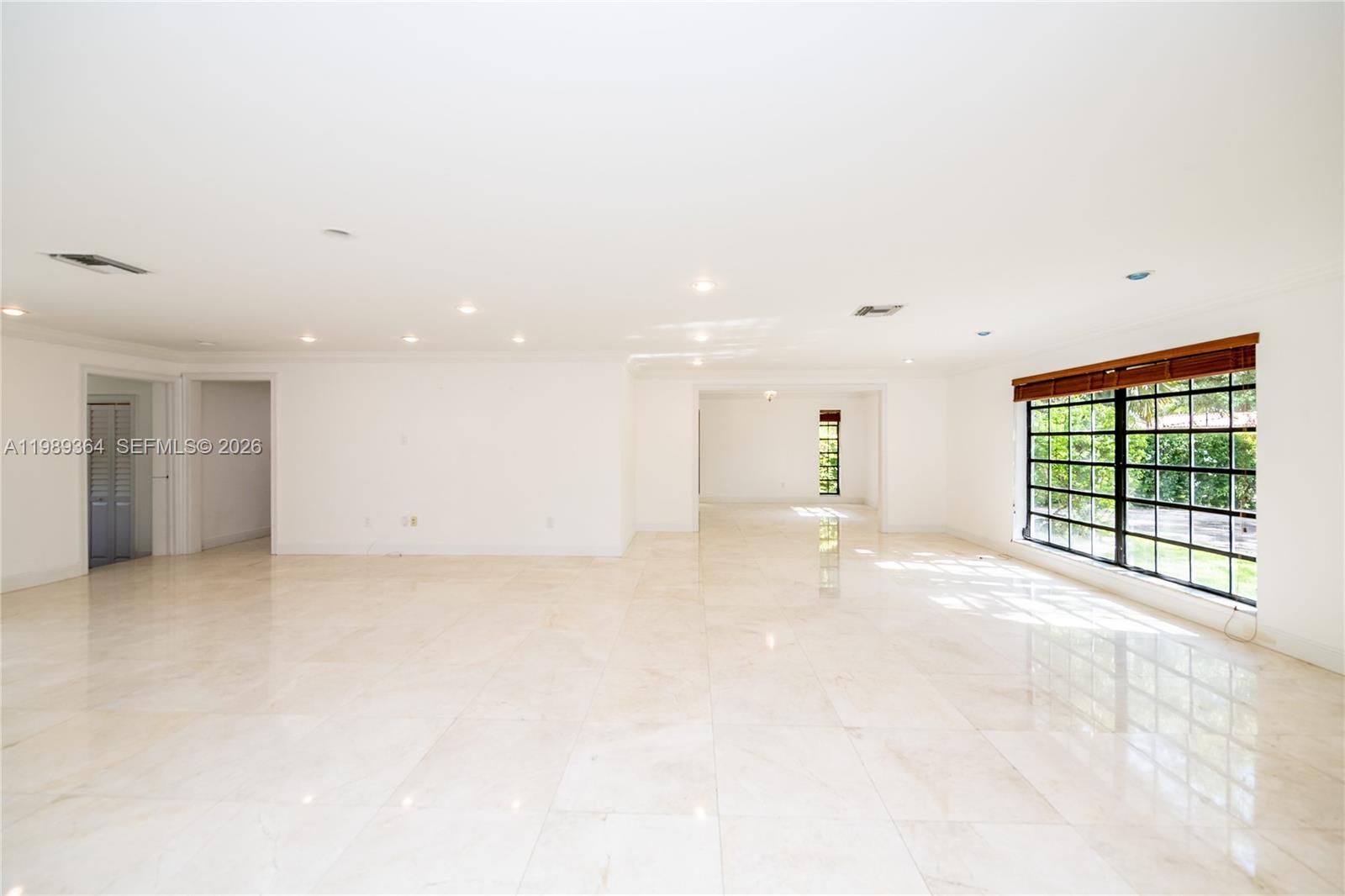 4160 Bay Point Road Miami, FL 33137 - Photo 7 of 60 a view of an empty room with a window